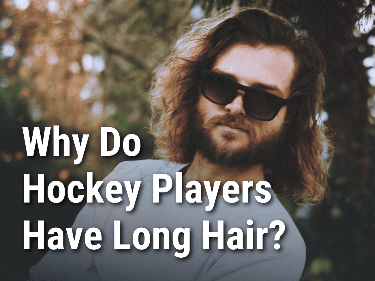 Why do hockey players have long hair? Man with long hair.
